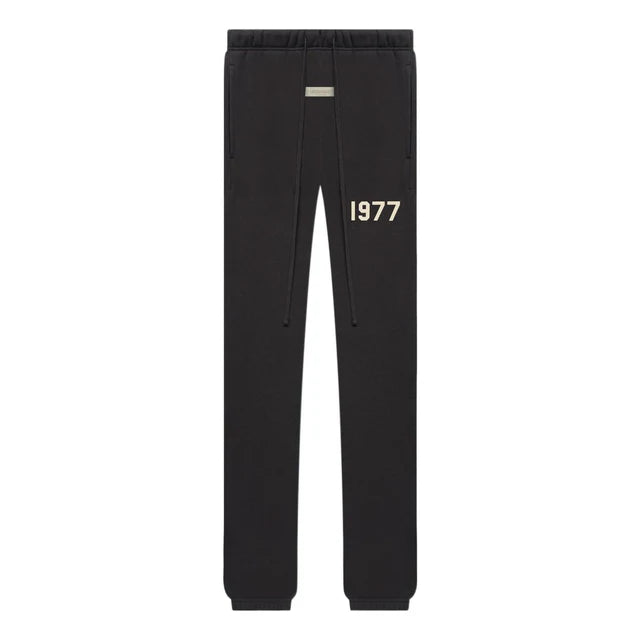 Fear of God Essentials Iron sweatpants SS22 in faded black heavyweight fleece with relaxed tapered fit and tonal branding